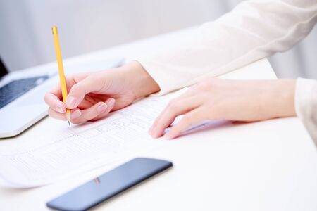 Female hand writing, close up