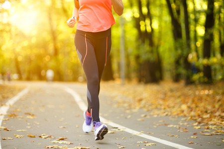 Woman exercise walking outdoors, shoes closeupの写真素材
