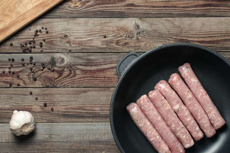 Raw Sausages in a Pan. Top viewの写真素材