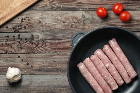 Raw Sausages in a Pan. Top viewの写真素材