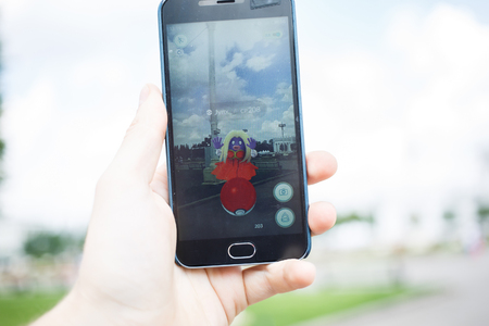 Roseville, CA/USA - July 11: An Android user reads the warning screen for the new Pokemon Go app that was released on July 6, 2016. It is an augmented reality mobile game for smart phones by Nianticのeditorial素材