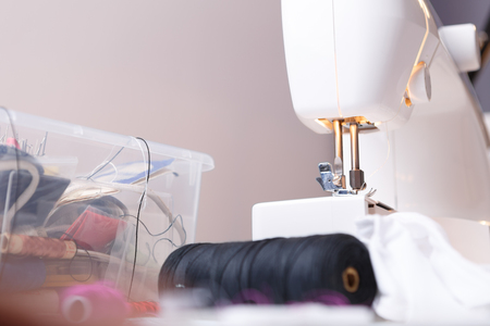Sewing machine close up with variety of accessories for sewingの写真素材