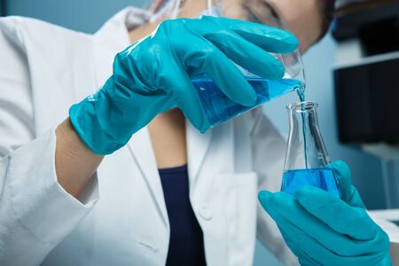 Laboratorian conducted experiments with flask