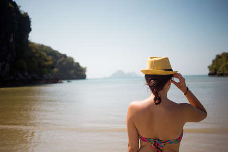Woman with hat and swimsuitの写真素材