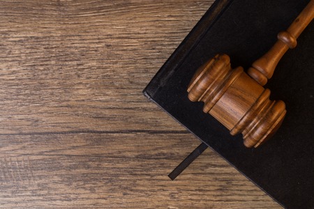 Judges hammer l on black notepadの写真素材