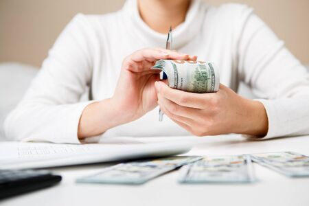 Hands counting money, close up