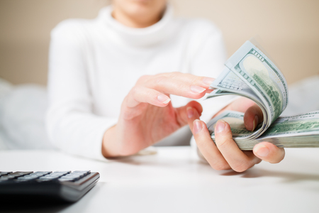 Woman countring money.の写真素材