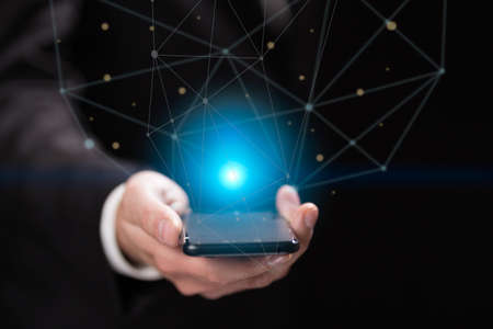 Businessman holding blue crystal ballの写真素材