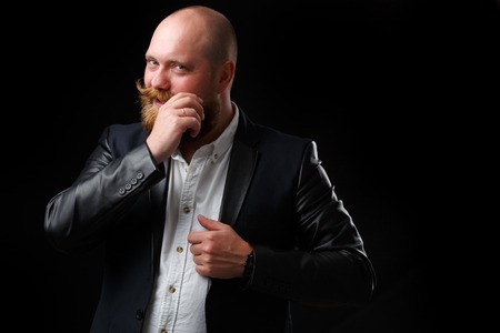 Man twirling his ginger mustachesの写真素材