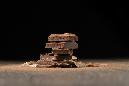 Chocolate on empty black backgroundの写真素材