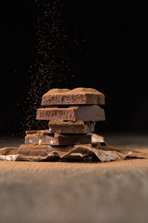Broken chocolate on bakery paperの写真素材