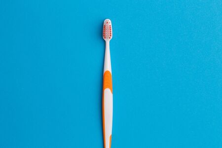 Photo of one orange toothbrushの写真素材