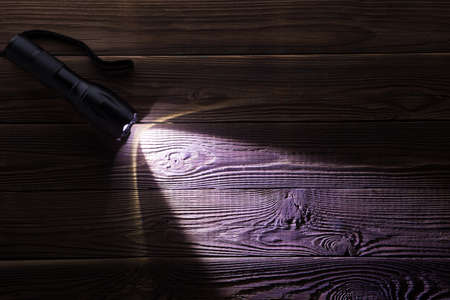 Wooden texture with glowing flashlight