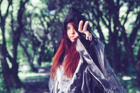 Image of witch in cloak