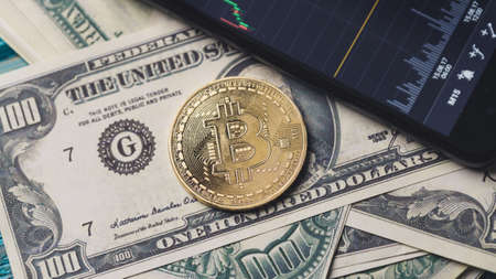 Image bitcoin, smartphone with chartの写真素材