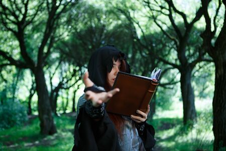 Picture of witch with spell bookの写真素材