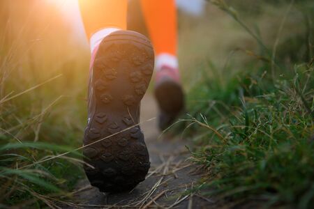 Athlete walking in forest at morningの写真素材