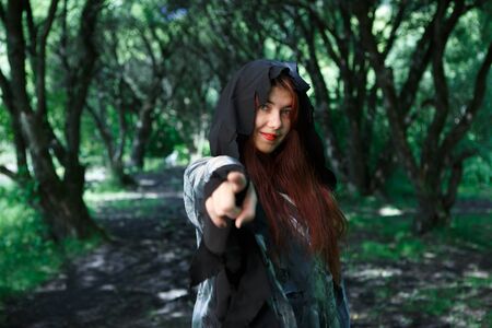 Witch pointing finger at cameraの写真素材