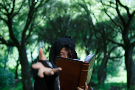 Image of witch with magic bookの写真素材