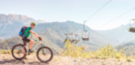 Photo of man in helmet riding bicycle