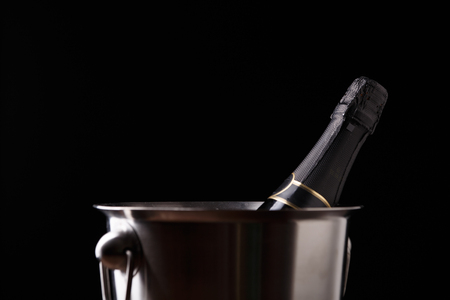 Image of bottle of wine in iron bucketの写真素材