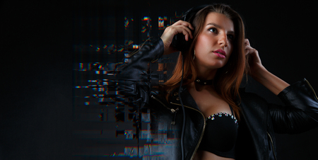 Picture of brunette in headphones listening to musicの写真素材