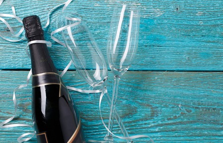 Image of two wineglasses, bottle of champagne, white ribbonsの写真素材
