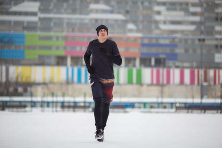Photo of running athlete in stadiumの写真素材