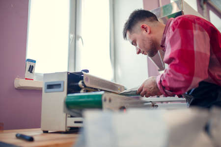 Image of businessman weighing paper bags