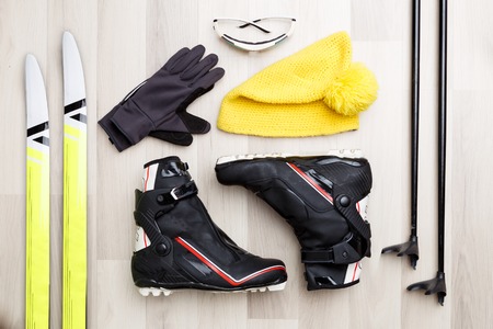 Photo of skier accessories on wooden background.の写真素材