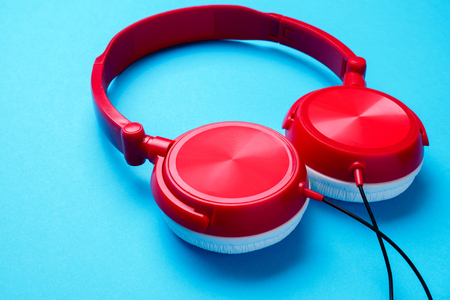 Photo of red with white headphones for music from aboveの写真素材