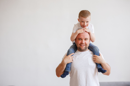 Picture of young father with son on shouldersの写真素材