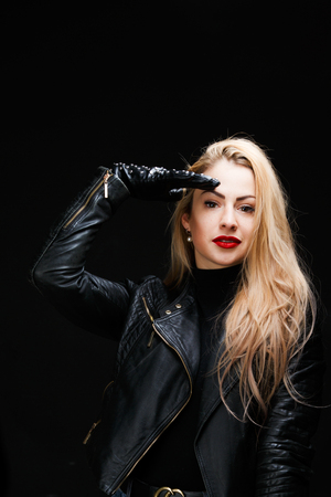 Photo of young blonde in leather jacket makes saluteの写真素材