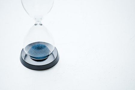 Photo of hourglass on isolated white backgroundの写真素材