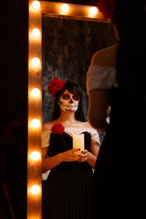 Image of witch girl with bodypainting on her faceの写真素材