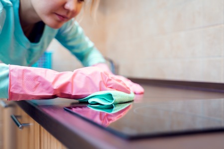 Picture of female hands in pink gloves washing hobの写真素材