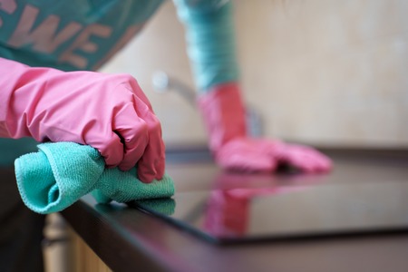 Picture of female hands in pink gloves washing hobの写真素材
