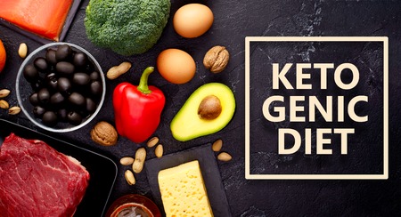 Photo of products for diet on black stone table .Ketogenic diet concept.の写真素材