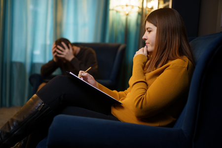 Image of woman psychologist and man at consultation.の写真素材