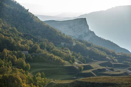 Image of picturesque mountain terrain, foggy sky in summerの写真素材