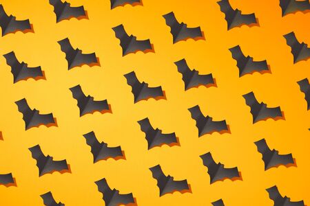Halloween photo of black bats on blank orange backgroundの写真素材