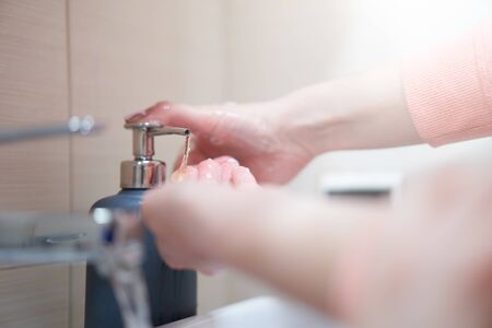Washing of hands with soap under water