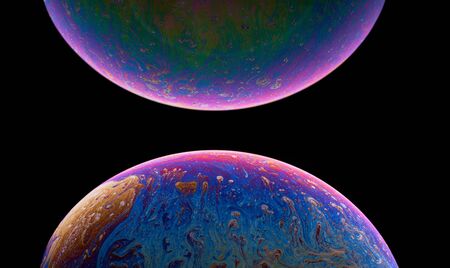 Soap bubble isolated on black. Space, planet, universe concept