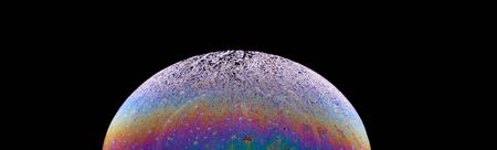 Soap bubble isolated on black. Space, planet, universe conceptの写真素材