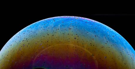 Soap bubble isolated on black. Space, planet, universe conceptの写真素材