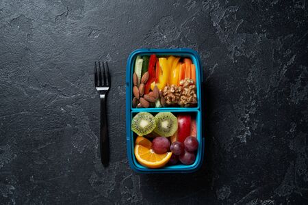 Top View of Full Lunch Box with Fruits, Vegetables and nuts.の写真素材