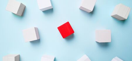 Wooden cubes blue background, business concept