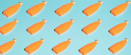 Several orange containers for cosmetics without labelの写真素材