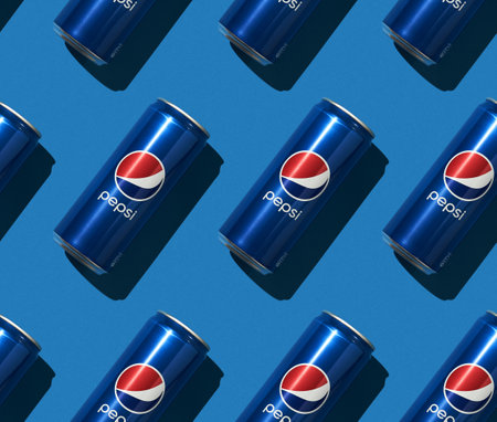 16.01.2021 Moscow, Russia. Pepsi can on blue background. Seamless pattern.