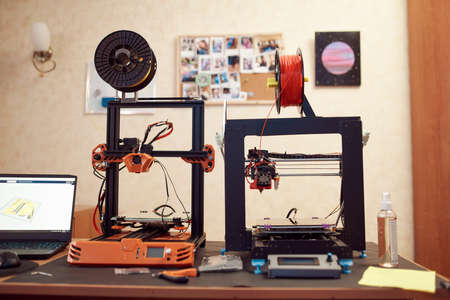 3D printers near netbook in workshop